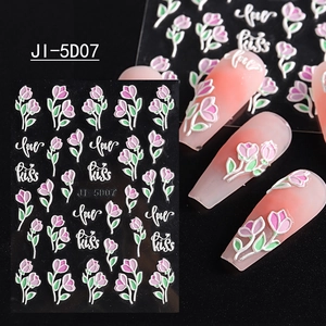 Detailed view of 5D embossed nail stickers featuring pink tulips and love kiss designs