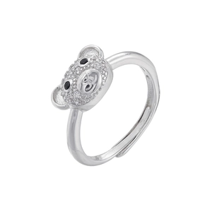 Macro detail of silver adjustable ring featuring a teddy bear head set with zircon stones