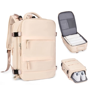 Large beige travel backpack with 180 degree main compartment and separate shoe storage