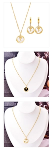 Detailed shot of French vintage gold necklace and earrings set with rose shell pendants