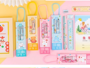 Detailed close-up of 5-in-1 stationery set in cute cartoon gift box with handle