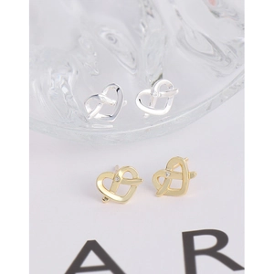 Modern intertwined heart stud earrings with zircon in silver and gold finishes