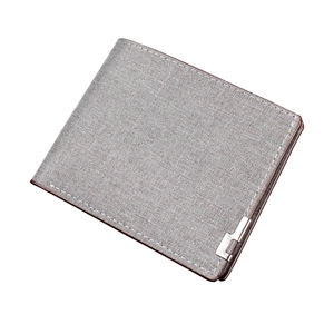 Men's short bifold canvas wallet in grey with brown trim and metal logo ornament