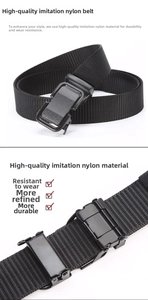 Detail of black nylon tactical belt with matte metal buckle and durable woven texture
