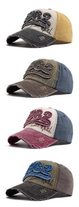 Detailed view of vintage 1962 baseball caps with distressed cotton and embroidered patches