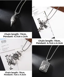 Detailed close-up of four gothic pendants including skull bird, cross, and nautical anchor