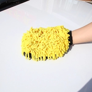 Close-up of yellow chenille microfiber car wash mitt on a white vehicle hood