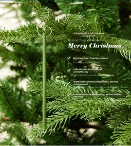 Macro view of green pine scented sticks with metal hooks hanging on a Christmas tree
