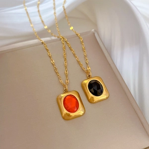 Square gold plated titanium necklace with emerald-cut red and black gemstones for women