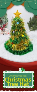 Close-up of a festive Christmas tree party hat with green tinsel and colorful pom-poms