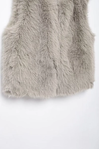 Detail view of the soft grey faux fur texture on the lower part of this stylish vest