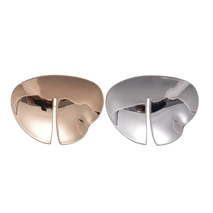 Polished rose gold and silver irregular geometric brooches with a minimalist abstract design