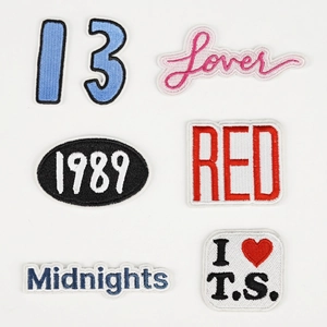 Detailed embroidery patches set featuring Lover, Red and Midnights album title designs