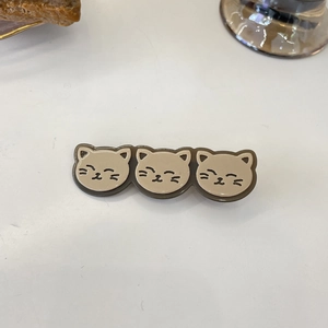 Cute cartoon cat hair clip in brown and beige tones for daily hairstyling