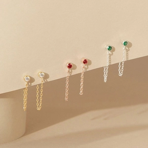 Three-color stainless steel tassel stud earrings with colorful rhinestones in macro view