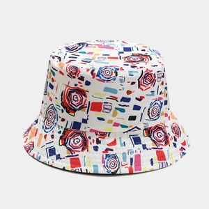 Detail of white bucket hat with colorful abstract geometric prints and cotton texture