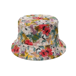 Detail of colorful floral sun hat featuring multi-colored print and reinforced stitching