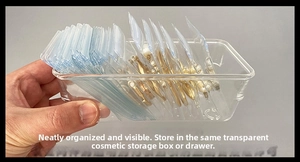 Close-up of clear jewelry storage bags in an acrylic box organizer with zip-lock seals