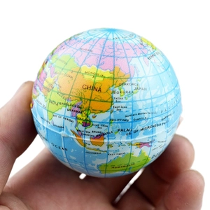 Detailed hand-held view of blue foam stress ball featuring a colorful world map print