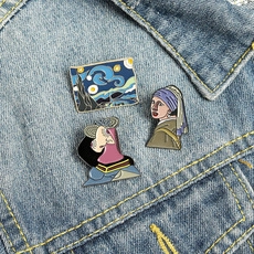 Three artistic enamel pins featuring Starry Night and famous paintings on denim jacket