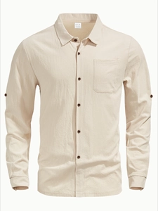 Detailed macro shot of beige linen blend fabric texture and button on men's beach shirt