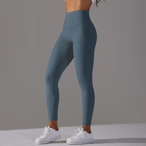 Detail view of smog blue high waist yoga pants showing seamless fabric and ankle hem finish