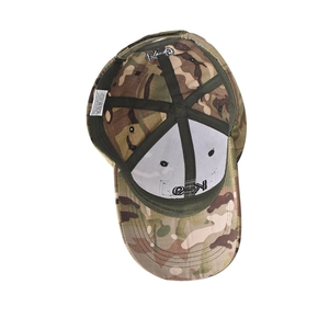 Detail view of the camouflage baseball cap interior with wash label and 65% polyester fabric