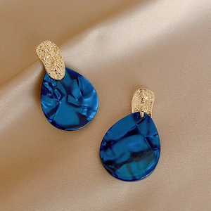 Retro blue acrylic water-ripple drop earrings with textured gold-tone metal studs