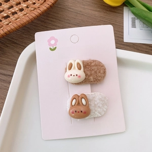 Detail of plush cartoon rabbit hair clips for kids on fashion display card set of two