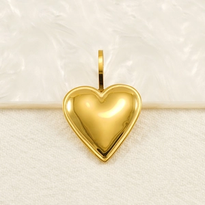 Polished gold heart pendant on minimalist stainless steel necklace for men and women