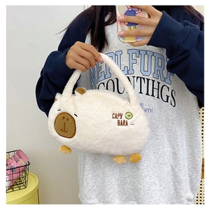 Detail of cute white capybara plush backpack with embroidered facial features and soft texture