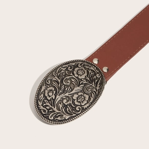 Vintage brown leather belt for women featuring an ornate floral engraved oval metal buckle