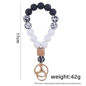 Silicone bead wristlet keychain with leopard print and wooden beads, 17cm size