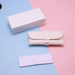 Detailed set featuring a pink woven texture sunglasses case with cleaning cloth and gift box