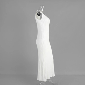 Detail of the white ribbed knit long dress showing V-neck and sleeveless slim fit texture