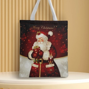 Detail of canvas Christmas tote bag featuring festive Merry Christmas print and handles