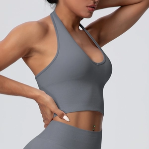 Detail of grey seamless racerback yoga bra with deep V-neck and ribbed hem texture