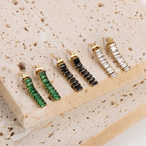 Three pairs of stylish gold stud earrings with square green, black and clear crystals