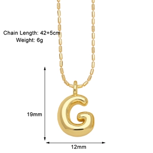 Detailed view of gold letter G pendant necklace with 42+5cm chain length and 6g weight