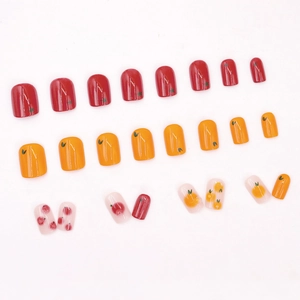 Short square press-on nails featuring vibrant orange and tomato fruit patterns
