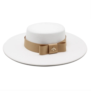 Elegant white wool boater hat with gold bee emblem and bronze ribbon on white background