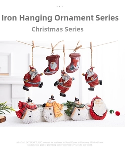 Detail of vintage iron Christmas ornaments showing Santa and snowman with rustic paint finish