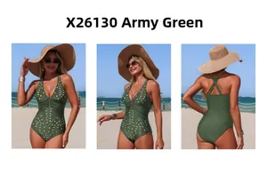 Detail view of military green one-piece swimsuit with laser-cut patterns and buckle