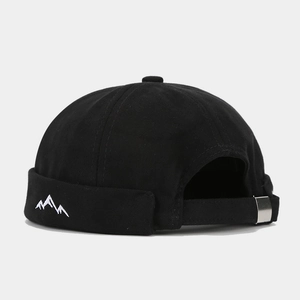 Detailed macro view showing back strap and mountain embroidery on black canvas Miki hat