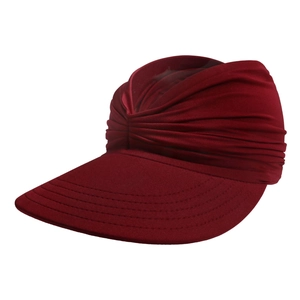Detail of burgundy sun visor featuring pleated turban style and reinforced stitched brim