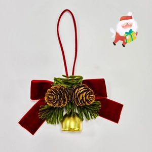 Christmas bow ornament with pine cones, red velvet ribbon, and golden bell on white background