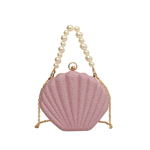 Pink sequin shell clutch bag with pearl handle and golden chain strap for women