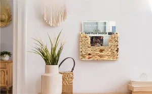 Detail of handwoven seagrass wall hanging organizer for magazines and documents