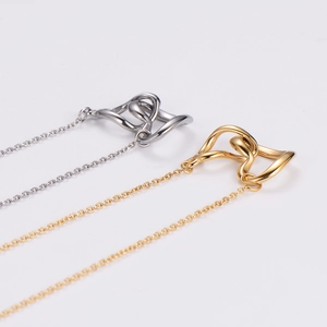 Polished stainless steel twisted heart pendant necklaces in gold and silver finishes