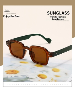 Detail of square polarized sunglasses with green wide temples and silver rivets